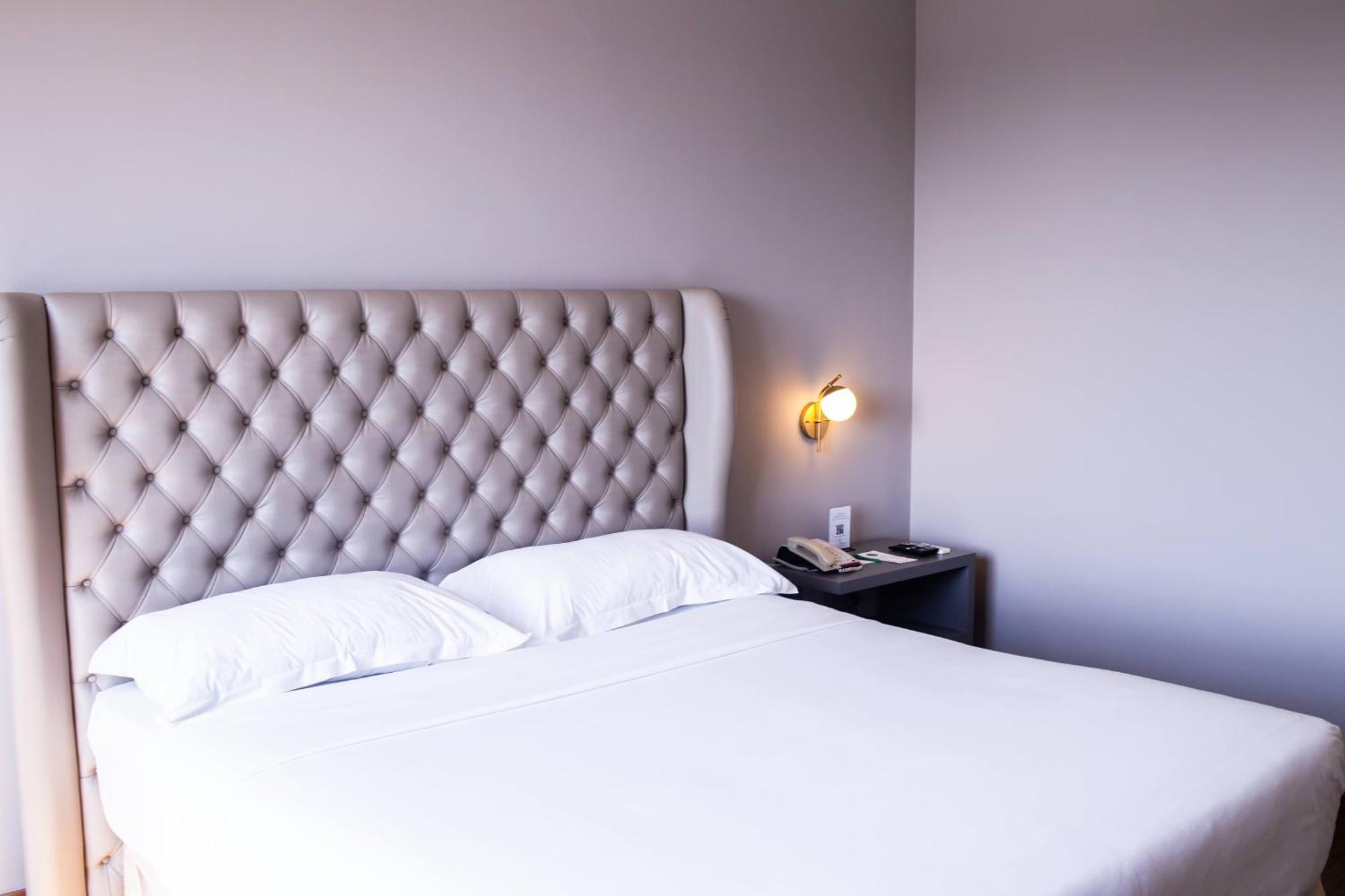 Ouro Minas Hotel Belo Horizonte, Dolce By Wyndham Extérieur photo A bedroom at the hotel